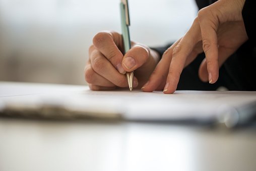 Hands Of A Person Writing On A Notepad Stock Photo - Download Image Now -  Writing - Activity, Pen, Women - iStock